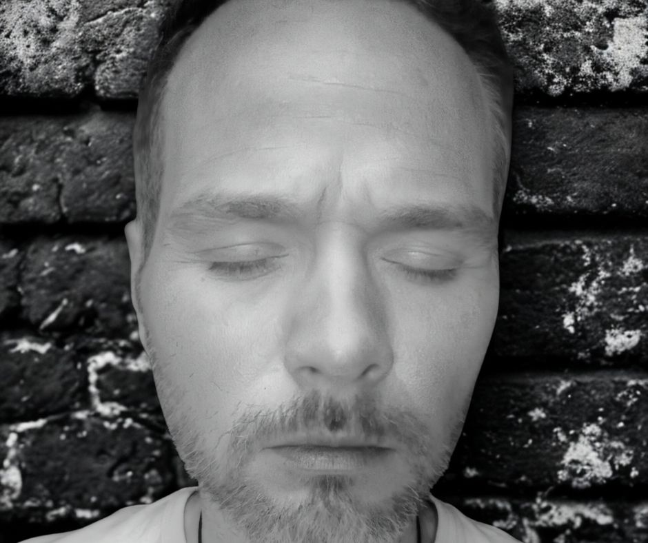 unedited portrait of billy coull eyes shut