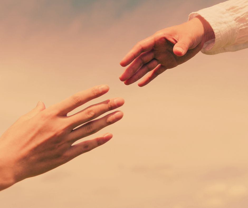 A close-up shot of a person’s hand letting go of another’s in soft, natural light. Symbol of separation, regret, and emotional vulnerability.